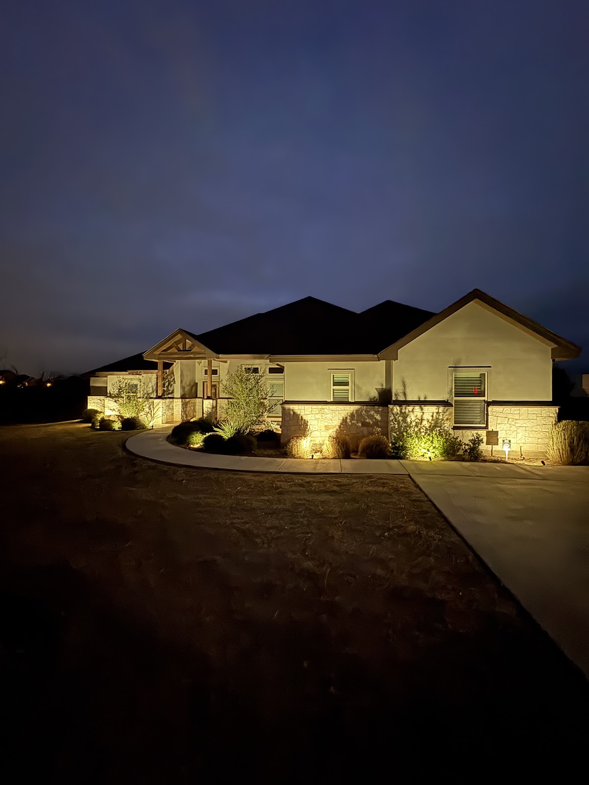 Home at dusk with landscape lighting